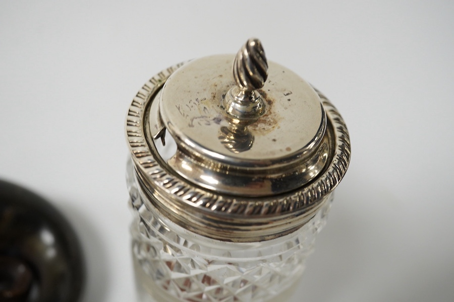 A 19th century white metal mounted horn snuff mull(split), 72mm, a small late Victorian silver cruet stand, a silver topped glass jar, a silver dish, small silver spoon and a white metal pill box. Condition - poor to fai